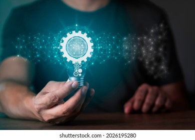 Hand holding light bulb and gear icon inside with network connection Innovative technology. Inspiration, brainstorming creative ideas for new innovations. Business technology creativity idea concept.
