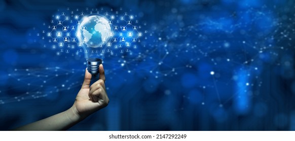 Hand Holding Light Bulb Global Business Technology And People Network Community. Idea Connection And Idea For Effective Networking. Mixed Media Concept. Abstract Blue Background.