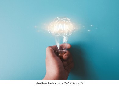 A hand holding a light bulb with glowing AI circuit design, concept of artificial intelligence, smart technology, digital innovation,machine learning, smart ideas, technology evolution.