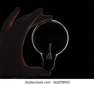 Hand Holding lightbulb - Powered by Shutterstock