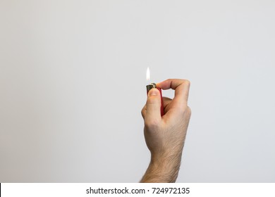 Hand Holding A Lighter.