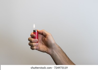 Hand Holding A Lighter.