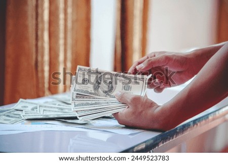 Hand holding loan money dollar bank note give financial payment. Man hands showing spread 100 dollar exchange cash payout. Saving Businessman counting money banknote  bribe corruption concept.