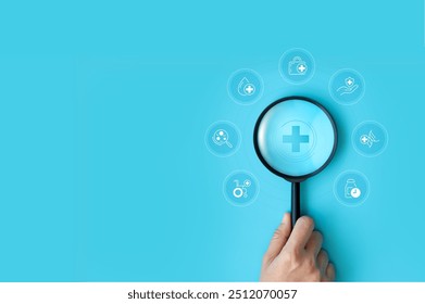 Hand holding magnifying glass focus plus and healthcare medical icon on blue background. health insurance concept and access to welfare. medical technology. - Powered by Shutterstock