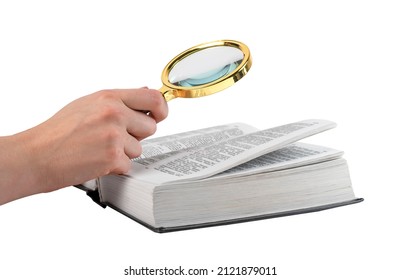 Hand holding magnifying glass for reading book isolated on white background. Relevant information search, study concept. High quality photo - Powered by Shutterstock