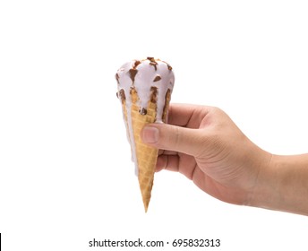 Hand Holding A Melting Peanut Flavor Ice Cream Cone