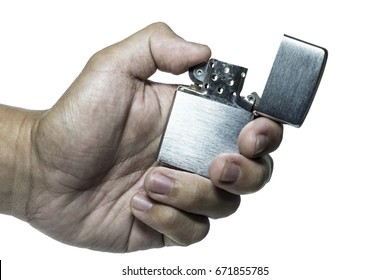 A Hand Holding Metal Windproof Lighter isolated - Powered by Shutterstock