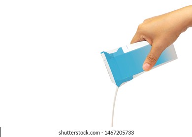 Hand Holding Milk Box Pouring To Something Isolated On White Background