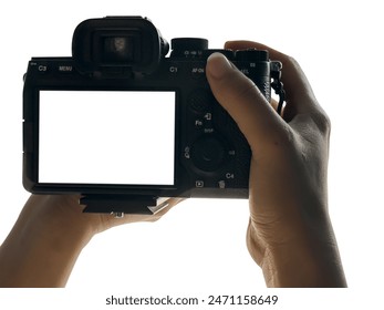 Hand holding Mirrorless camera with white screen isolated on white background, clipping path - Powered by Shutterstock