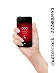 hand holding mobile phone with emergency number 000 isolated over white background
