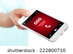 hand holding mobile phone with emergency number 000