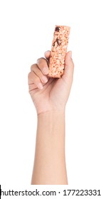 Hand Holding Munchies Health Cereal Candy Bar Isolated On White Background.