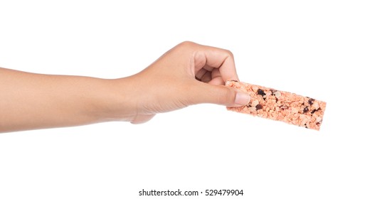 Hand Holding Munchies Health Cereal Candy Bar Isolated On White Background.