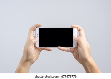 Hand Holding New 6 Inch Smart Phone With Blank Screen And  Playing Game Gesture Finger On White Background