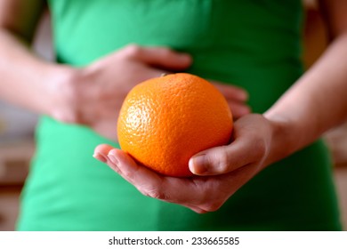 Hand Holding Nice Orange, Give Yourself One And Enjoy It And Have A Better Health.