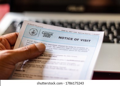 A Hand Holding A Notice Of Visit From The US Census Bureau: Chicago/USA-July 29, 2020