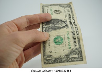 Hand Holding One Dollar Bancknote