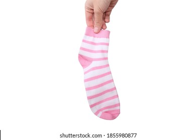 A Hand Holding One Pink And White Striped Cotton Organic Sock Isolated On White.