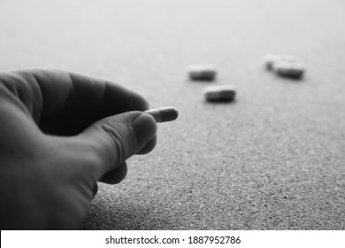 Hand Holding Opioid Pills. Drug Addiction Concept Photo. 