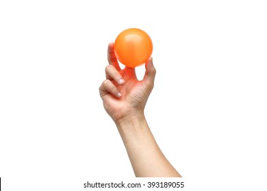 Hand Holding A Orange Plastic Ball