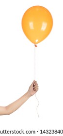 Hand Holding Orange Rubber Balloon Isolated On A White Background.