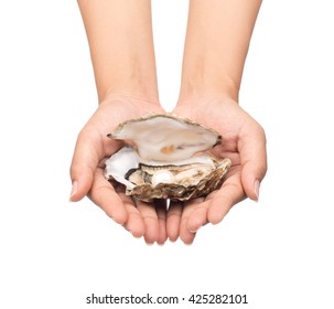 hand holding oyster with pearl isolated on white background