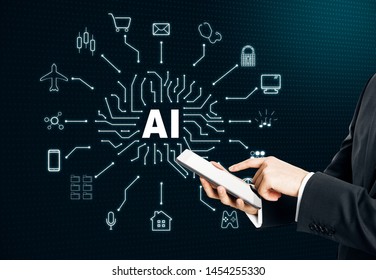 Hand holding pad with creative digital AI hologram on dark background. Artificial intelligence and future concept