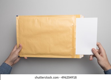 Hand Holding Padded Envelope Mock-up, Ready To Replace Your Design.