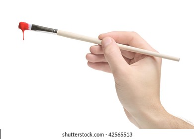 Hand Holding A Paint Brush On White Background