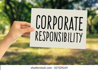 Hand Holding A Paper Card With Corporate Responsibility Concept On Abstract Nature Background