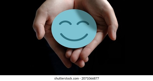 Hand Holding Paper Cut Smile Face, Positive Thinking, Mental Health Assessment , World Mental Health Day Concept