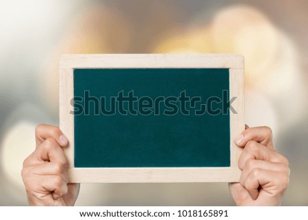 Hand holding a paper note