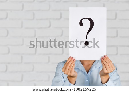 Hand holding a paper note