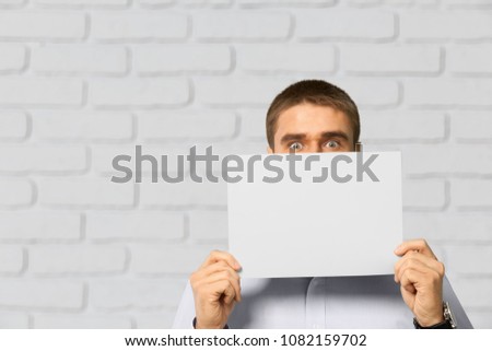 Hand holding a paper note