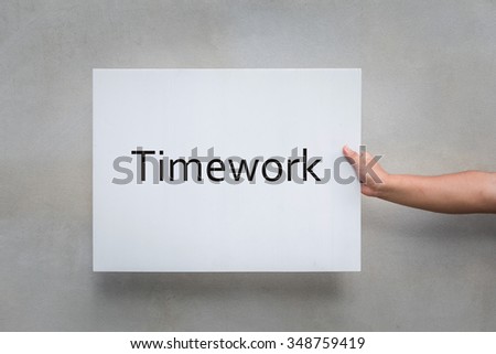 Hand holding paper timework message