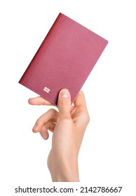Hand holding passport isolated on white background. Documents, visa, citizenship or emigration concept. Clipping path - Shutterstock ID 2142786667