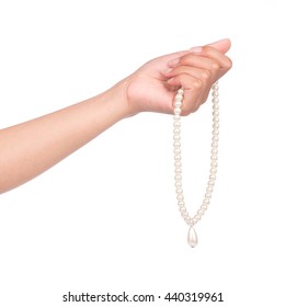 Hand Holding Pearl Necklace Isolated On White Background