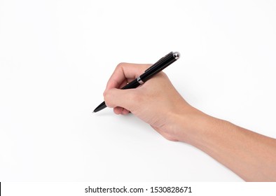 Hand Holding Pen Writing On White Background, Closeup.