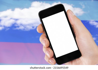Hand holding phone with black screen for logo on  Russia flag background.