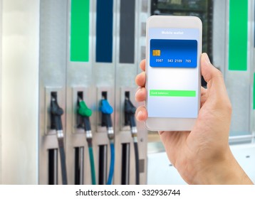 Hand Holding The Phone With Mobile Wallet To Pay Online At The Gas Station