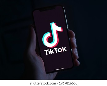 Hand Holding Phone With The TikTok Logo In Front Of A Black Background. The Chinese App Was Recently Banned By The Indian Government. Tiktokers Have Millions Of Fans. ByeTikTok