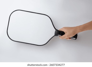 hand holding a Pickleball Paddle isolated on white background