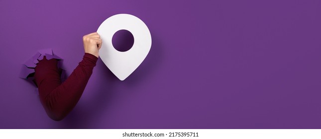 Hand Holding Pin Over Purple Background, Panoramic Layout