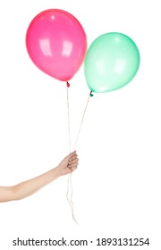 Hand holding Pink with Green Rubber Balloon isolated on a white background.