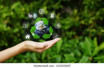Hand holding with Planet Earth surrounded by recycle icon over the Network connection on nature background, technology ecology concept.                - Powered by Shutterstock