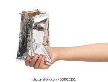 hand holding plastic bag snack packaging isolated on white background
