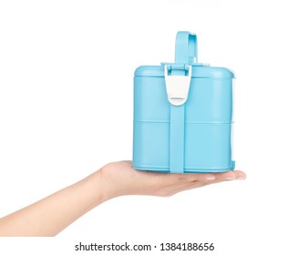 Hand Holding Plastic Tiffin Carrier Isolated On White Background