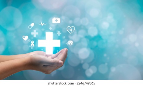 hand holding plus icon on blue background. Plus sign virtual means to offer positive thing like benefits, personal development, social network Profit,health insurance, growth concepts. - Shutterstock ID 2246749865