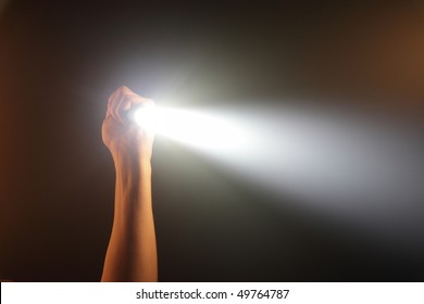 hand holding pocket flashlight