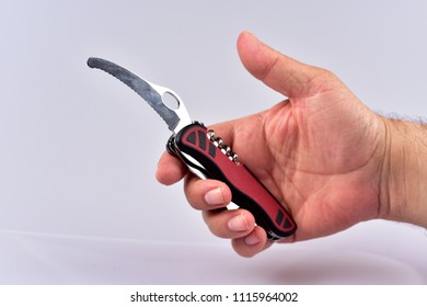 Hand, Holding Pocket Knife On White Background